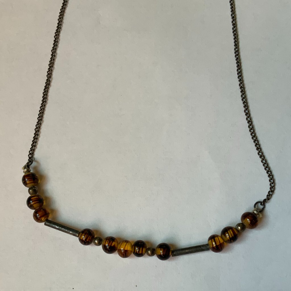 Necklace With Amber Brown And Metal Beads Along With Metal Slides